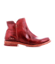 A single Yurisa ankle boot by Bed|Stü in red leather, featuring a low heel, visible stitching, and a durable leather outsole, is shown in a left side profile against a white background.