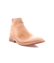 The Yurisa ankle boot by Bed|Stü is crafted from tan leather with a low heel, visible stitching, and slight wear, featuring a durable leather outsole and shown against a white background.