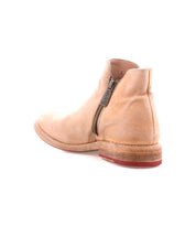 The Yurisa ankle boot by Bed|Stü showcases tan leather with a round toe, side zipper, and low wooden heel, complemented by a durable leather outsole for long-lasting wear—all elegantly photographed on a white background.