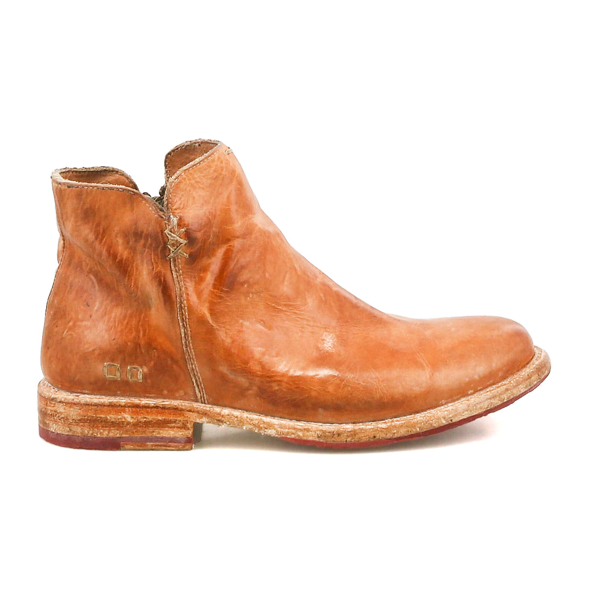 A single Yurisa ankle boot by Bed|Stü, handcrafted from brown leather with visible creases and stitching, features a low heel, a slightly worn sole with a durable leather outsole, and is shown in side profile against a white background.