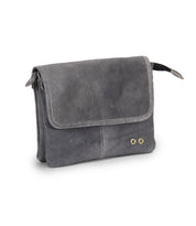 Introducing Ziggy by Bed|Stü: a compact, rectangular gray messenger bag meticulously crafted from supple leather. It features a front flap, visible stitching, and two gold-tone metal accents on the lower right corner. This versatile design can also be worn as a crossbody for added convenience.