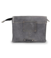 Introducing the Ziggy by Bed|Stü—a gray leather clutch handcrafted from supple leather with visible stitching, featuring a flap closure, a small front patch, and a signature Bed|Stü logo tag at the bottom center. This versatile bag can be carried as a crossbody or tucked inside your favorite belt bag.
