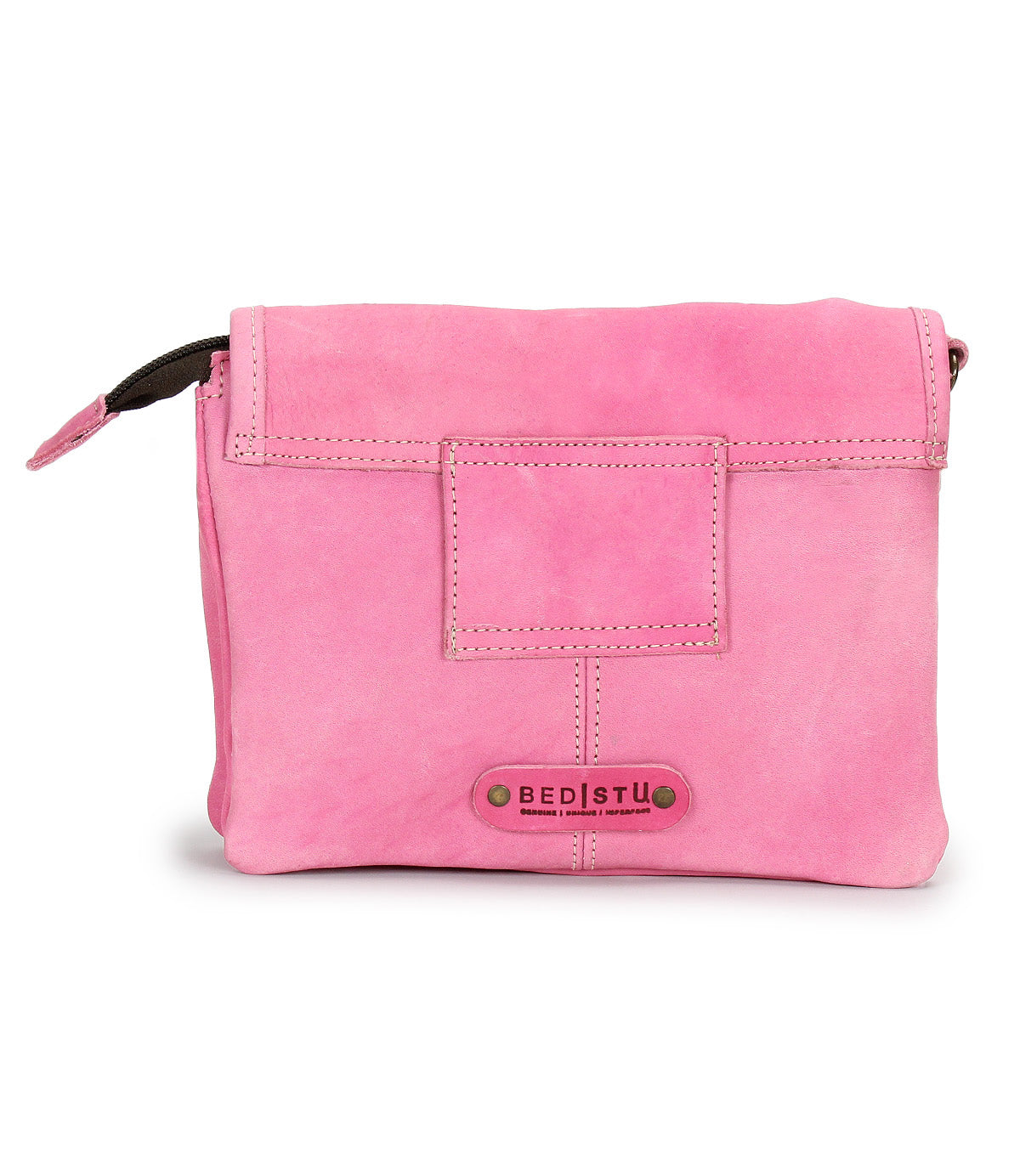 A pink supple leather crossbody bag called the Ziggy by Bed|Stü, featuring a front flap, exposed stitching, a small square pocket, and a "Bed|Stü" logo patch with two rivets.