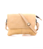 Introducing the Ziggy crossbody bag by Bed|Stü, crafted from light tan supple leather and featuring a front flap, adjustable shoulder strap, and minimal stitching details, shown against a white background.