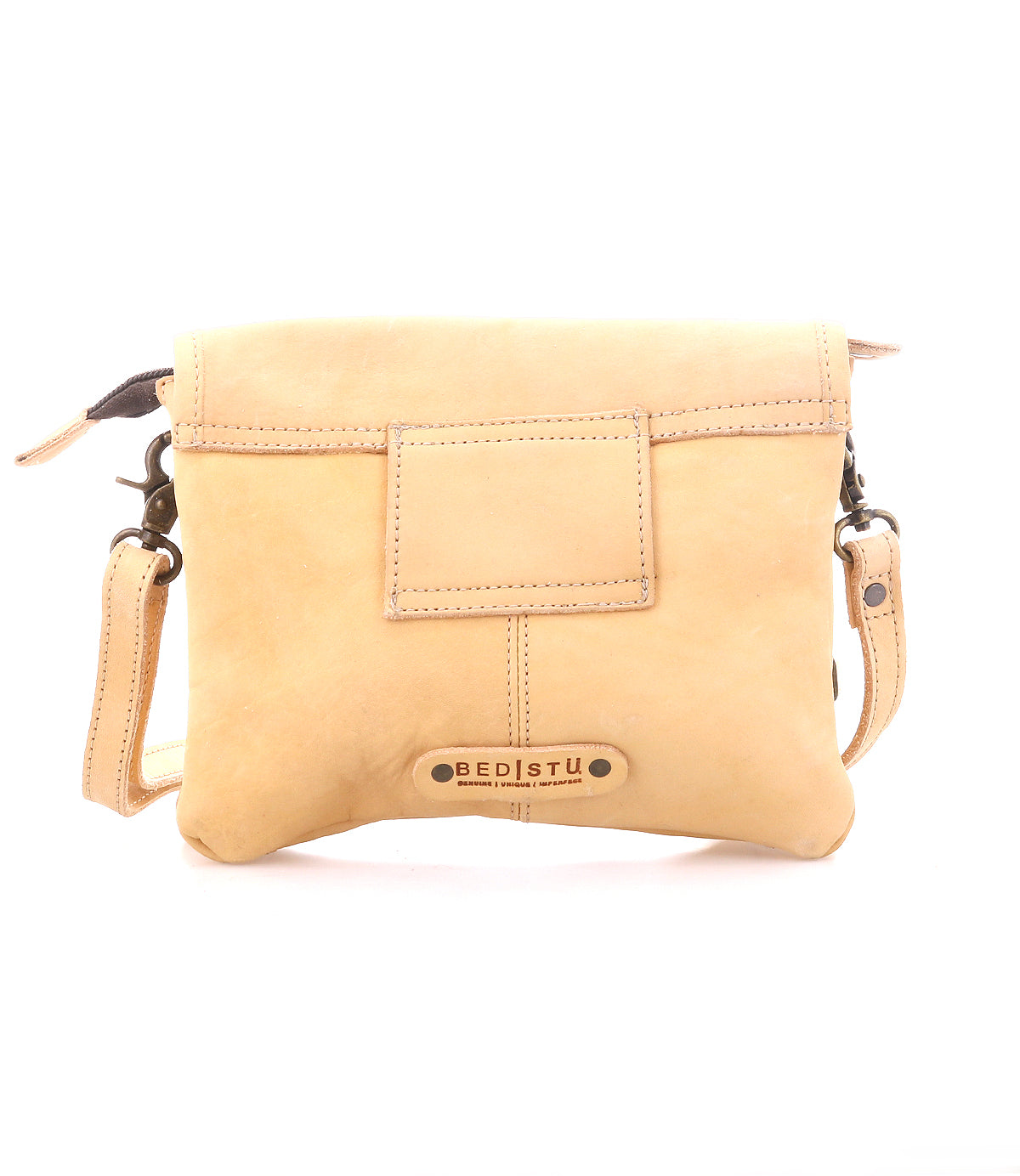 Light tan supple leather crossbody bag, Ziggy by Bed|Stü, featuring a front pocket, metal hardware, and a “Bed|Stü” logo plate at the bottom center.