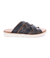 Introducing the Abraham Light slide sandal by Bed|Stü, crafted with a brown woven leather upper featuring crisscross straps and a lightweight outsole for all-day comfort—displayed in side profile against a white background.