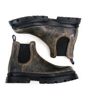 A pair of Bed|Stü Accelerate distressed brown leather Chelsea boots with black elastic side panels and rugged lug outsoles, offering a modern edge, shown side by side on a white background.