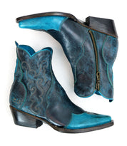 The Bed|Stü Ace boots are a pair of blue and turquoise Western boots crafted from full-grain leather, featuring decorative stitching and side zippers, shown from the side and bottom—a beautiful example of traditional boot making.