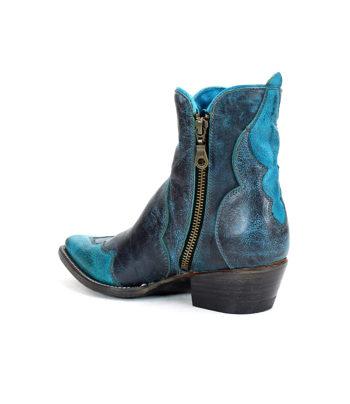 The Bed|Stü Ace is a blue and black distressed ankle Western boot, expertly crafted from full-grain leather using traditional boot making techniques. It features a side zipper and a low heel, and is photographed against a white background.
