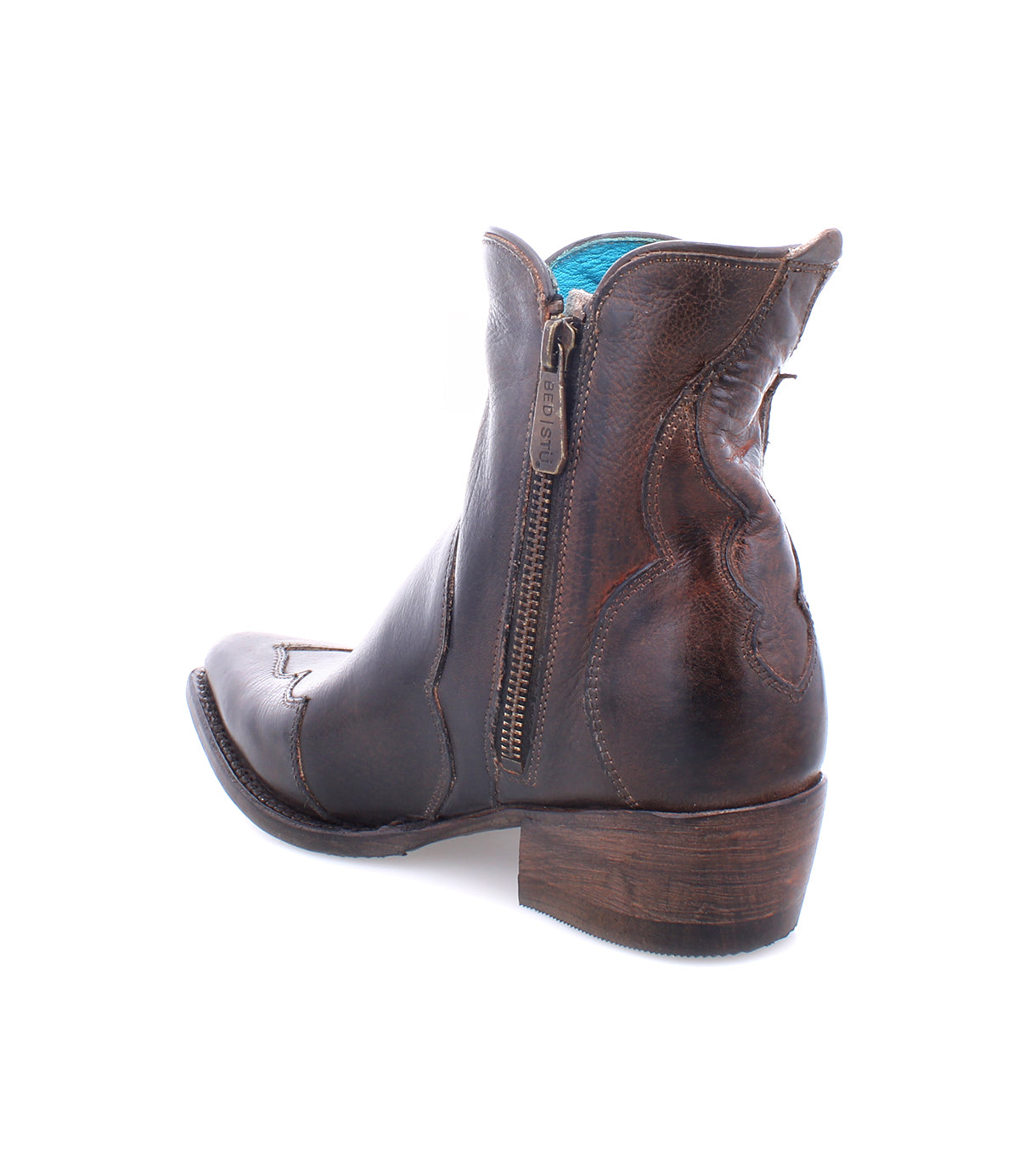 The Ace ankle boot by Bed|Stü, shown at an angle on a white background, is crafted from full-grain brown leather using traditional boot making techniques. It features a side zipper and a low, stacked wooden heel.
