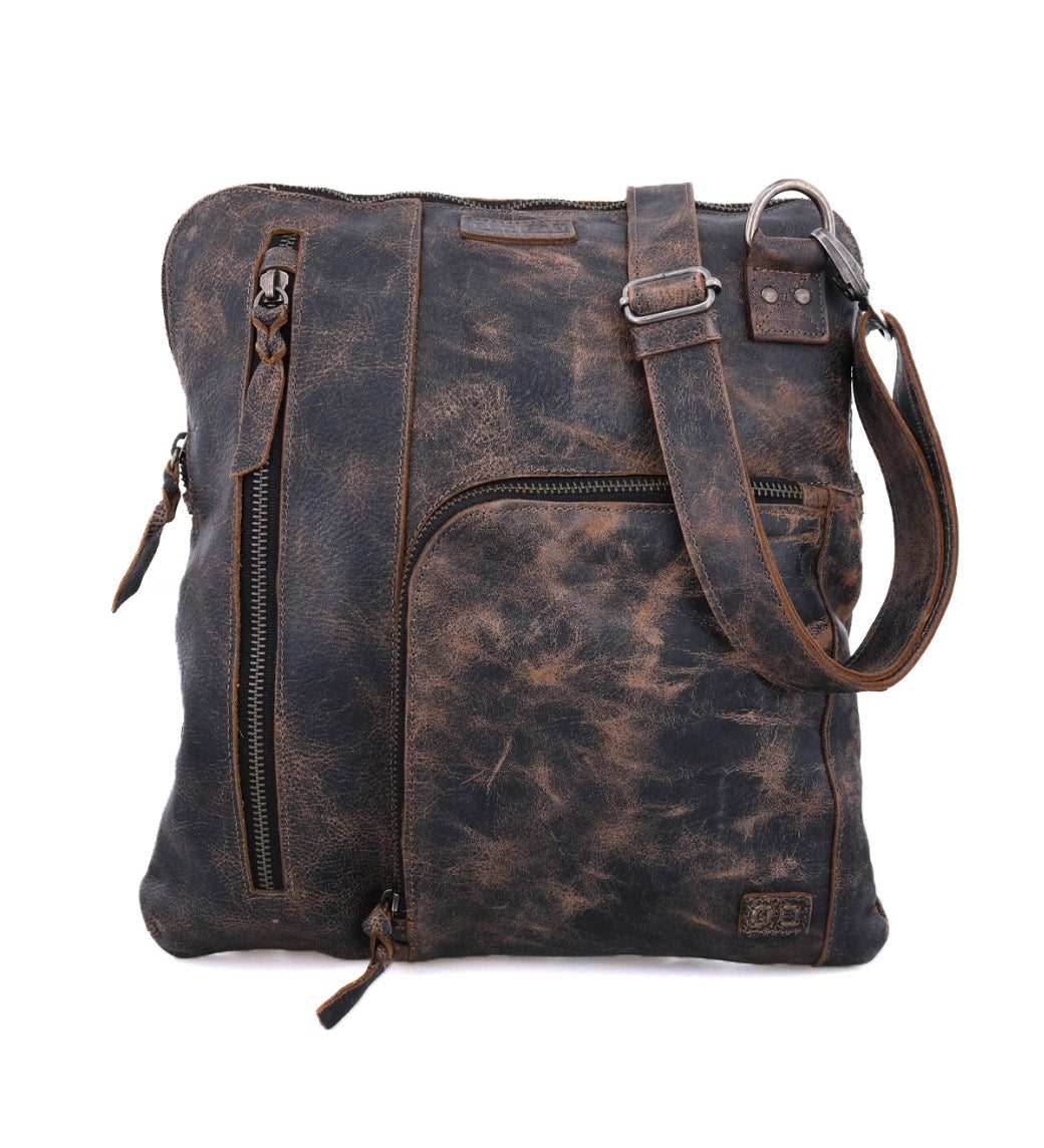 Introducing the Bed|Stü Aiken: a distressed brown full-grain leather crossbody bag featuring multiple zippered pockets, an adjustable strap for comfort, and distinct visible stitching details.