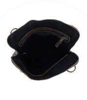 Open view of an empty Bed|Stü Aiken black full-grain leather bag with brown trim and a visible inner pocket.
