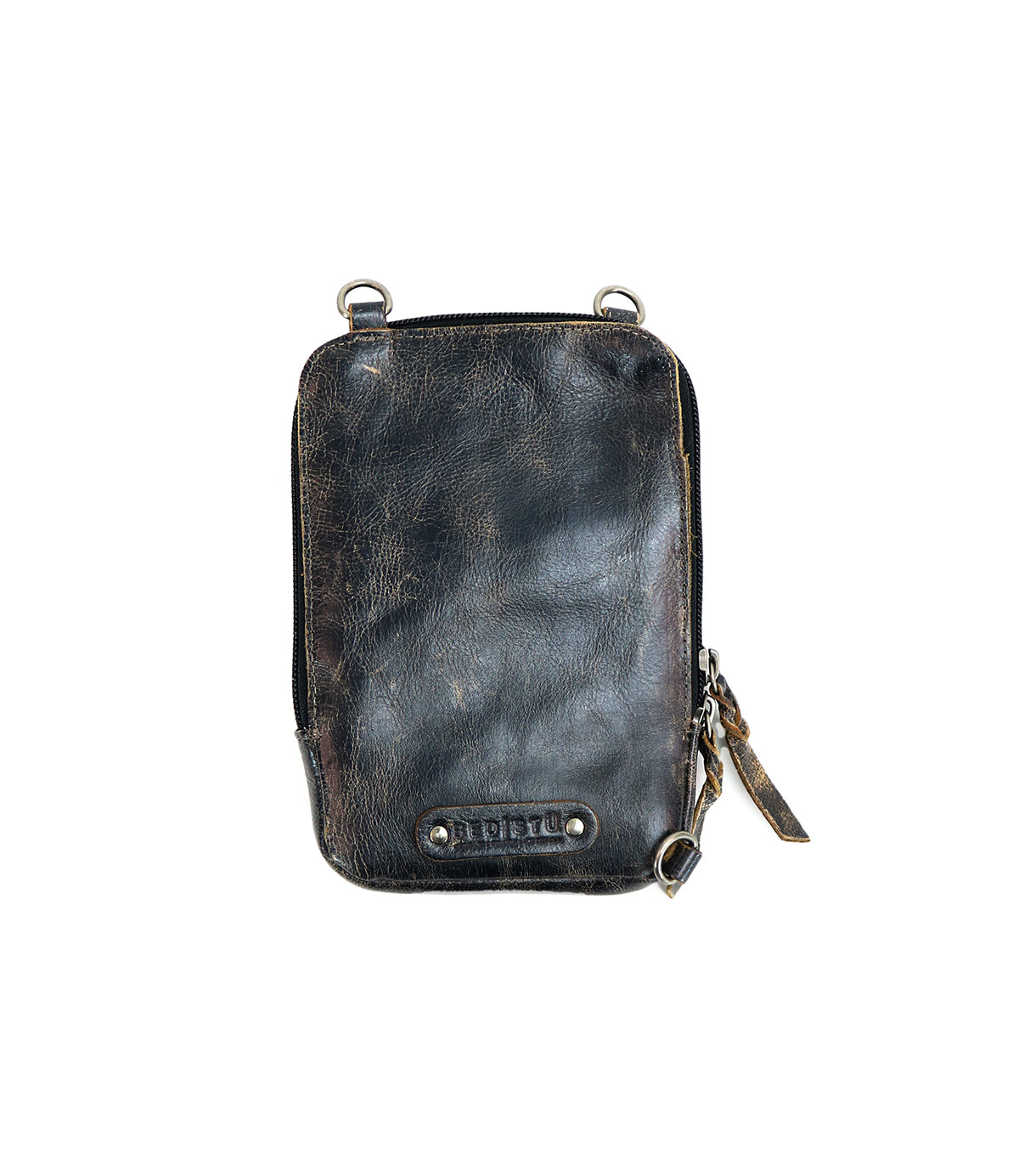 The Alelike pouch by Bed|Stü is a small, rectangular distressed black leather bag featuring a zipper closure, metal rings at the corners, and a branded Bed|Stü label on the front. With its vintage-worn texture and timeless style, it’s perfect as a compact purse for carrying your travel essentials on any outing.