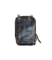 The Alelike pouch by Bed|Stü is a small, rectangular distressed black leather bag featuring a zipper closure, metal rings at the corners, and a branded Bed|Stü label on the front. With its vintage-worn texture and timeless style, it’s perfect as a compact purse for carrying your travel essentials on any outing.