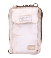 A small, light-colored leather crossbody pouch from Bed|Stü, the Alelike features a front flap pocket, zipper closure, and a "BEDSTU" label on the front—perfect for carrying your travel essentials as a compact purse.