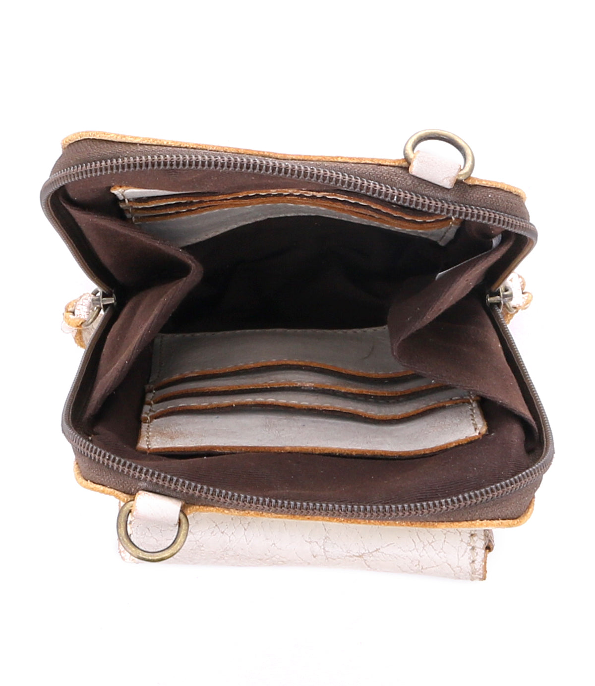 The Bed|Stü Alelike wallet in brown and beige is shown from above, revealing multiple card slots, spacious compartments, and an empty interior—perfect for organizing travel essentials in a compact purse or pairing with your favorite leather crossbody.