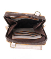 The Bed|Stü Alelike wallet in brown and beige is shown from above, revealing multiple card slots, spacious compartments, and an empty interior—perfect for organizing travel essentials in a compact purse or pairing with your favorite leather crossbody.
