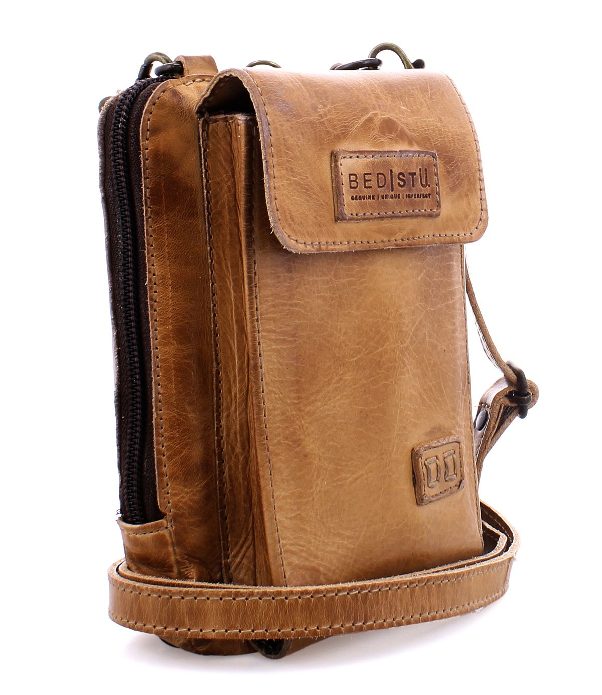 The Bed|Stü Alelike is a light brown leather crossbody bag featuring a flap closure, zippered compartment, and adjustable strap; this compact purse is perfect for travel essentials and showcases the "BED|STU" logo on the front flap.