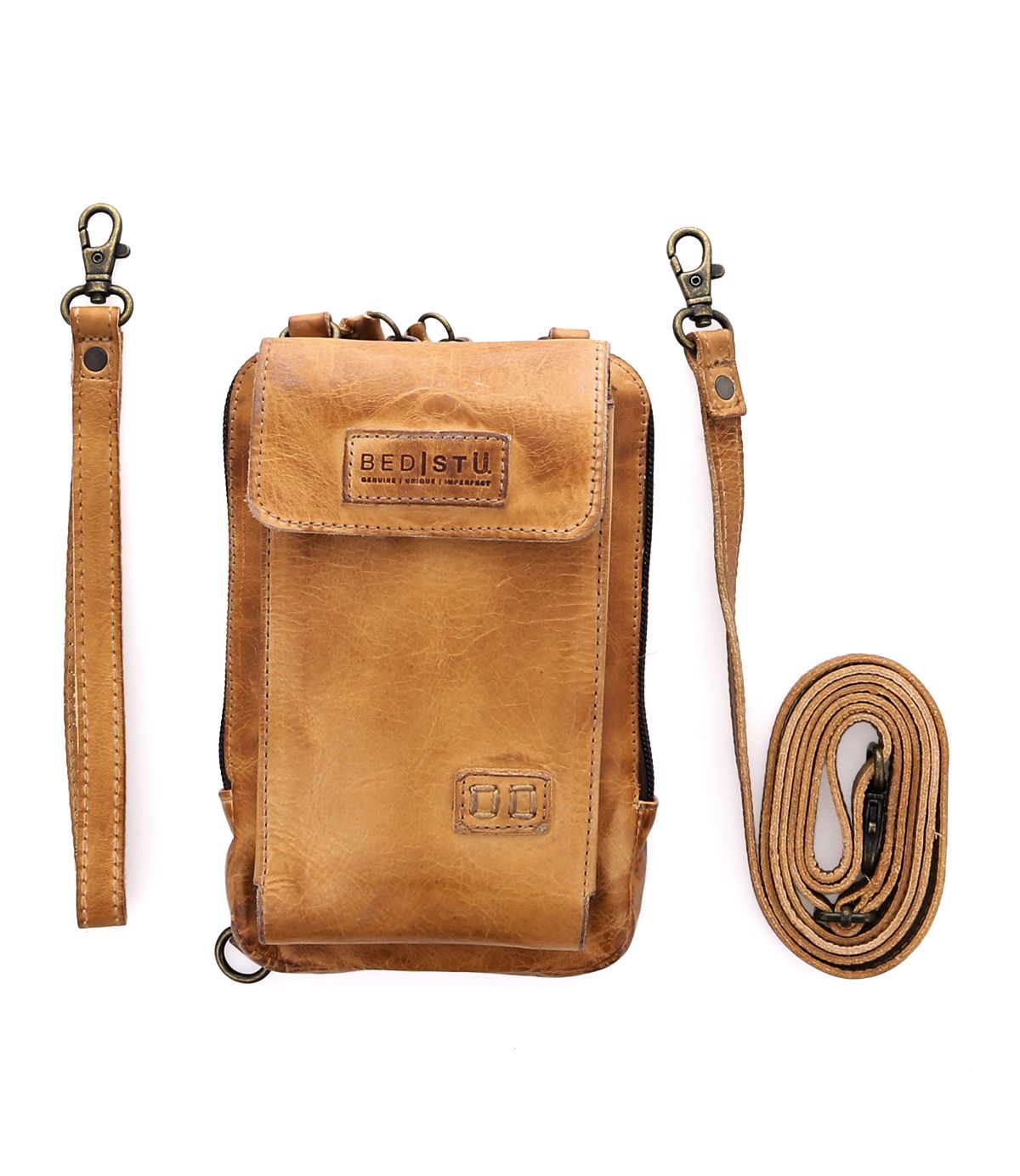 Alelike crossbody bag by Bed|Stü in light brown leather, ideal for carrying travel essentials, displayed on a white background with two detachable straps—a short one and a long one—arranged beside it.