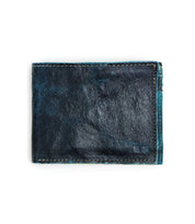 A closed, worn blue leather Amidala bifold wallet by Bed|Stü, featuring visible stitching and displayed on a white background.