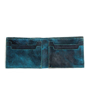 A blue bifold wallet from Bed|Stü's Amidala collection, featuring four card slots, is displayed open and empty against a white background.