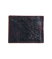 The Bed|Stü Amidala is a closed, textured black leather bifold wallet featuring prominent red stitching along the edges, displayed against a white background.