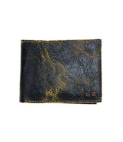 Introducing the Amidala by Bed|Stü—a closed black bifold wallet featuring a textured, worn surface with gold streaks, displayed against a white background.