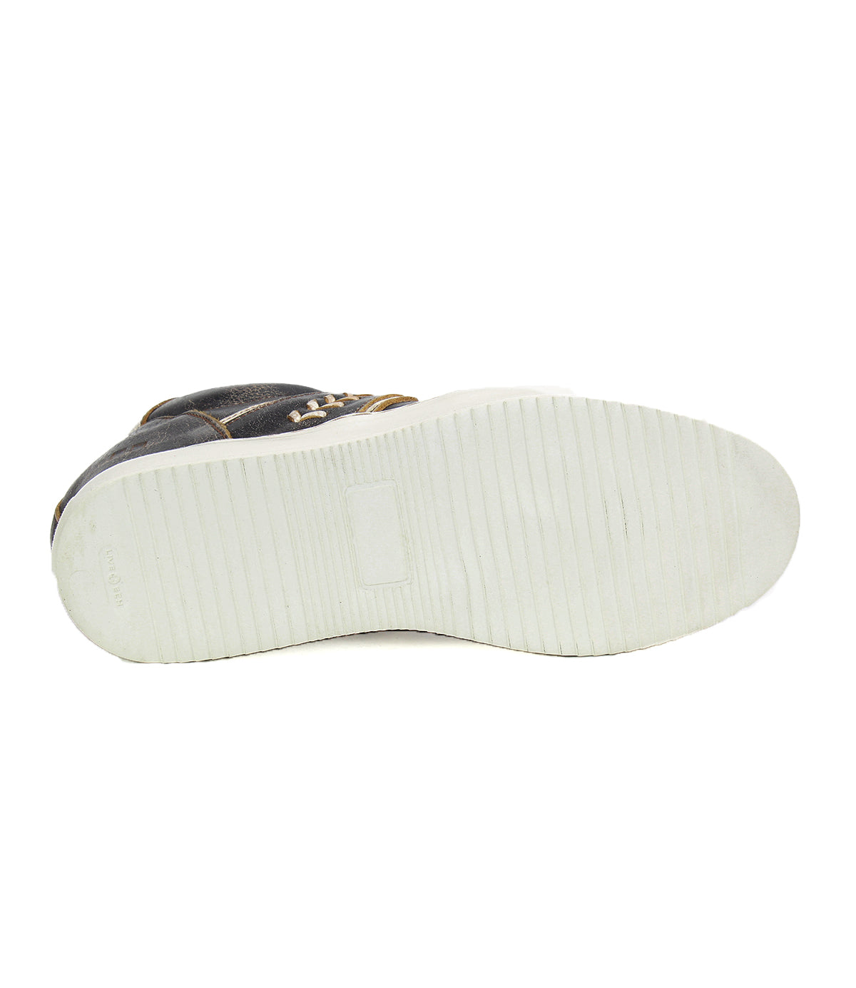 The image shows the white rubber sole with a textured pattern of the Bed|Stü Andromeda sneaker, viewed from the bottom.