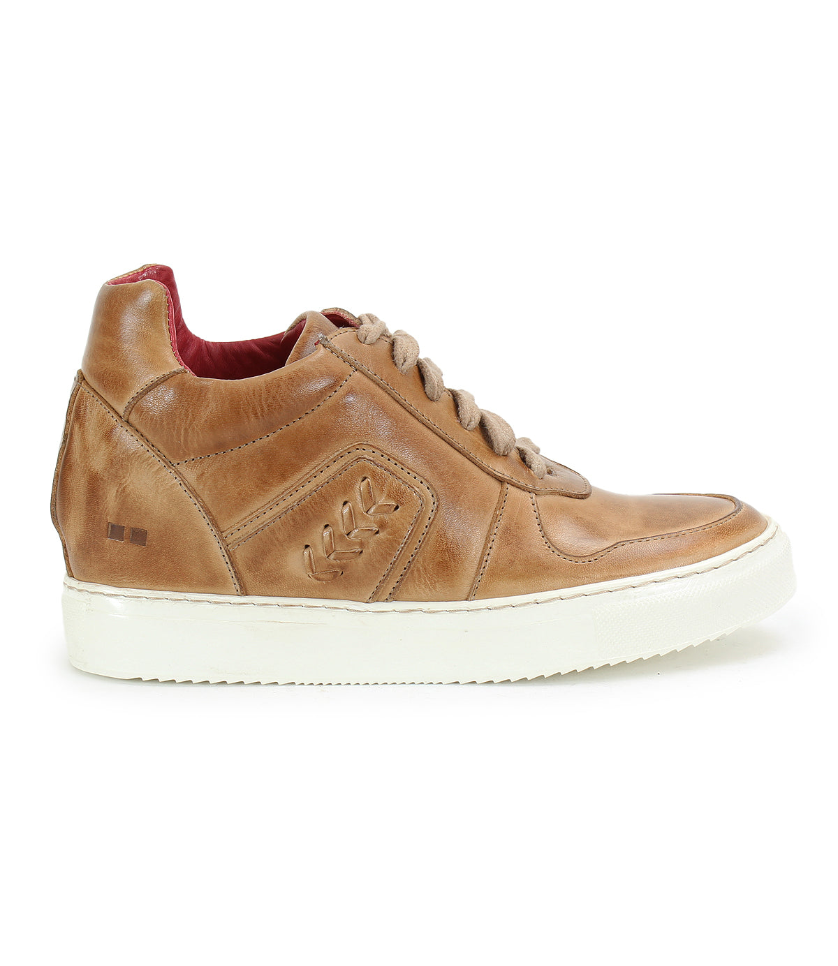 The Andromeda by Bed|Stü is a light brown leather sneaker featuring a white sole, decorative side accents, and tan laces. Designed for city style, this full-profile left-facing shoe showcases a vibrant red interior lining for an added pop of color.