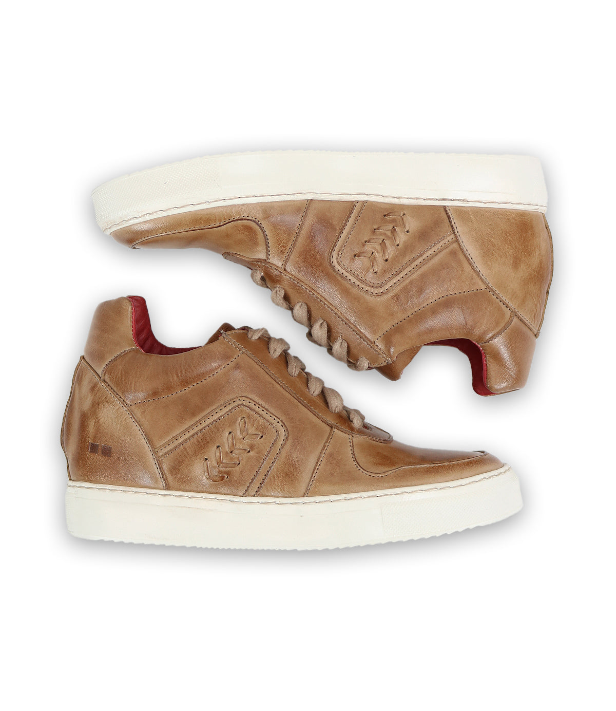 Introducing the Andromeda by Bed|Stü—a pair of light brown leather sneakers featuring white soles, a red inner lining, and decorative side stitching. Shown in a side view against a white background, these city-ready sneakers are perfect for elevating your everyday urban style.