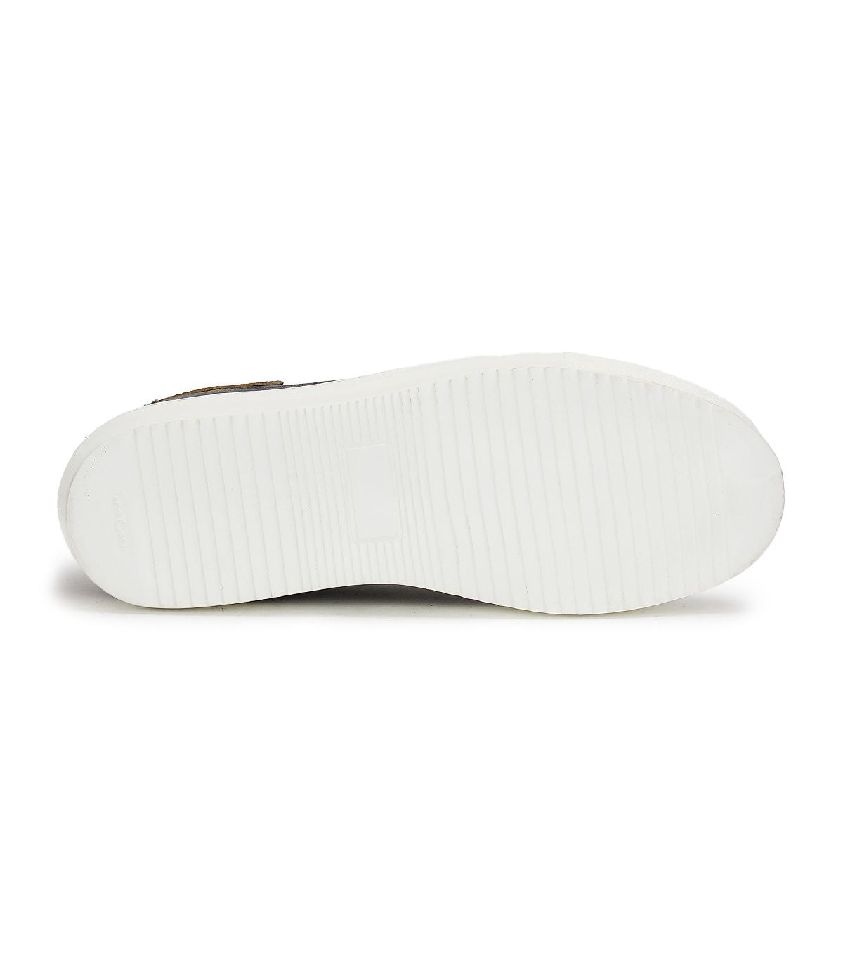 The image displays the white, textured sole of the Bed|Stü Azeli leather sneaker, featuring subtle horizontal grooves and a central rectangular logo area, emphasizing its durable rubber outsole engineered for all-day comfort.