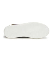 The image displays the white, textured sole of the Bed|Stü Azeli leather sneaker, featuring subtle horizontal grooves and a central rectangular logo area, emphasizing its durable rubber outsole engineered for all-day comfort.