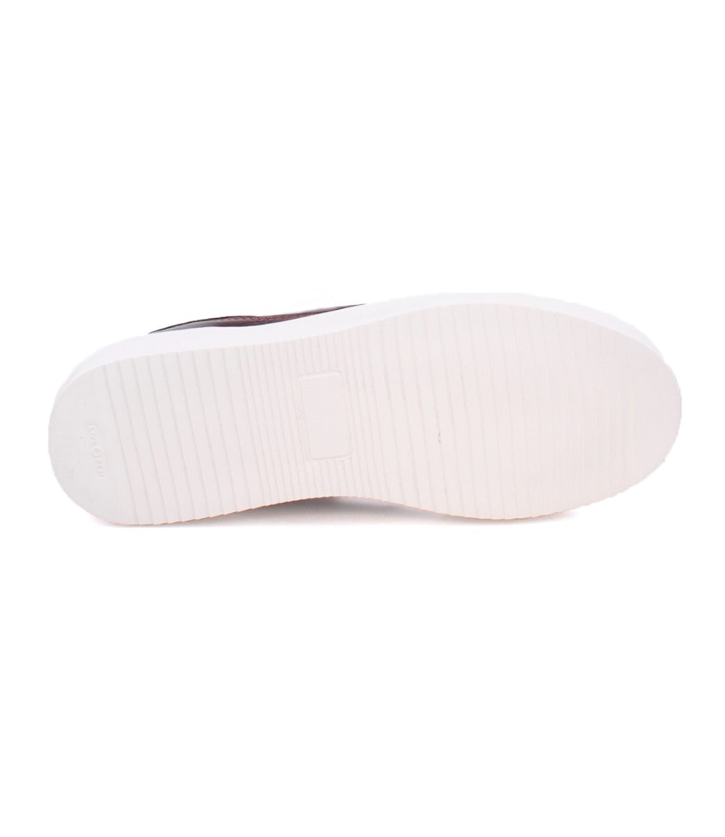 The image displays the bottom view of the Azeli shoe by Bed|Stü, featuring a white rubber sole with a textured grip pattern that emphasizes its durable rubber outsole, crafted for all-day comfort.