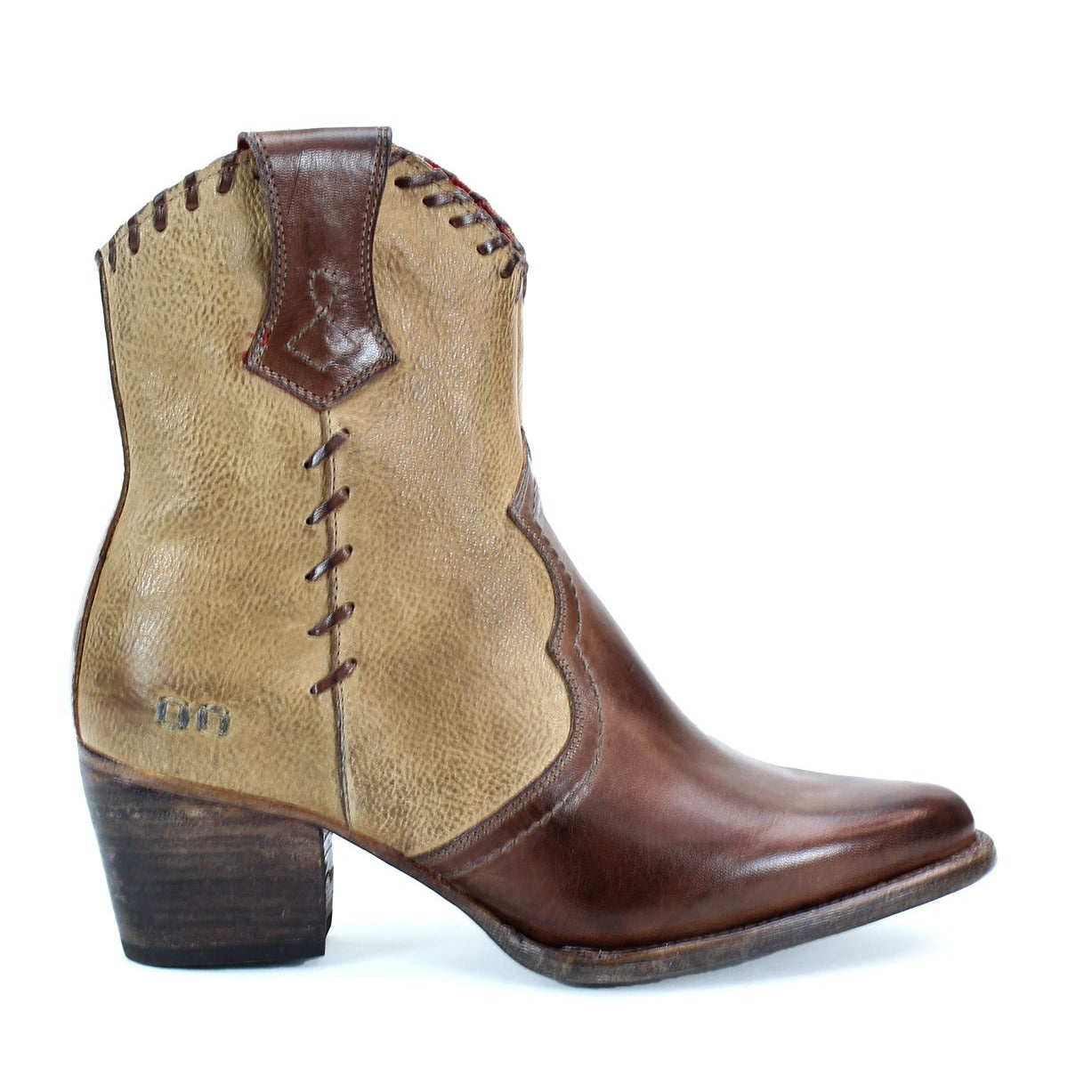 The Bed|Stü Baila II is a brown and tan leather cowboy boot featuring artisanal construction, decorative stitching, a low heel, and a pointed toe, displayed in profile against a white background.