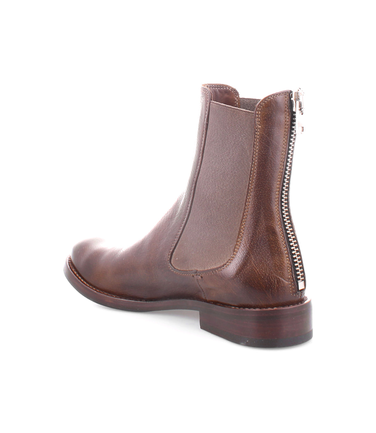Introducing the Barfly boot from Bed|Stü—a brown ankle boot meticulously crafted from premium Italian leather, showcasing a Chelsea boots-inspired elastic side panel, a low heel for added comfort, and a distinctive back-zip closure with a visible silver zipper elegantly running down the back.