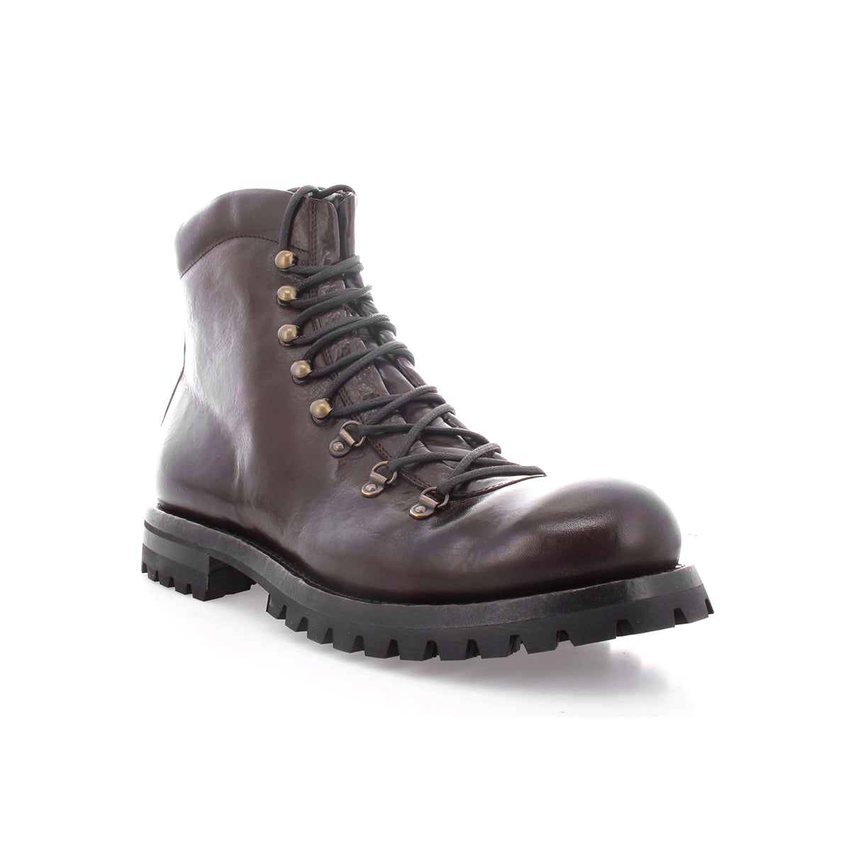 The Bed|Stü Barge is a dark brown lace-up combat boot crafted from Italian leather, featuring metal eyelets and a thick black treaded sole, shown angled to display the front and side against a white background.