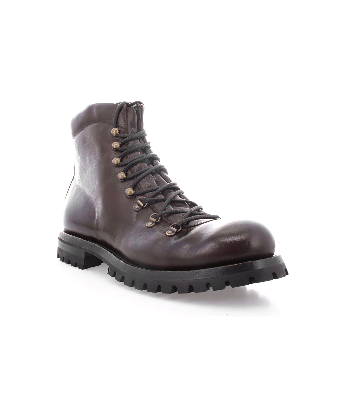 The Bed|Stü Barge is a dark brown lace-up combat boot crafted from Italian leather, featuring metal eyelets and a thick black treaded sole, shown angled to display the front and side against a white background.
