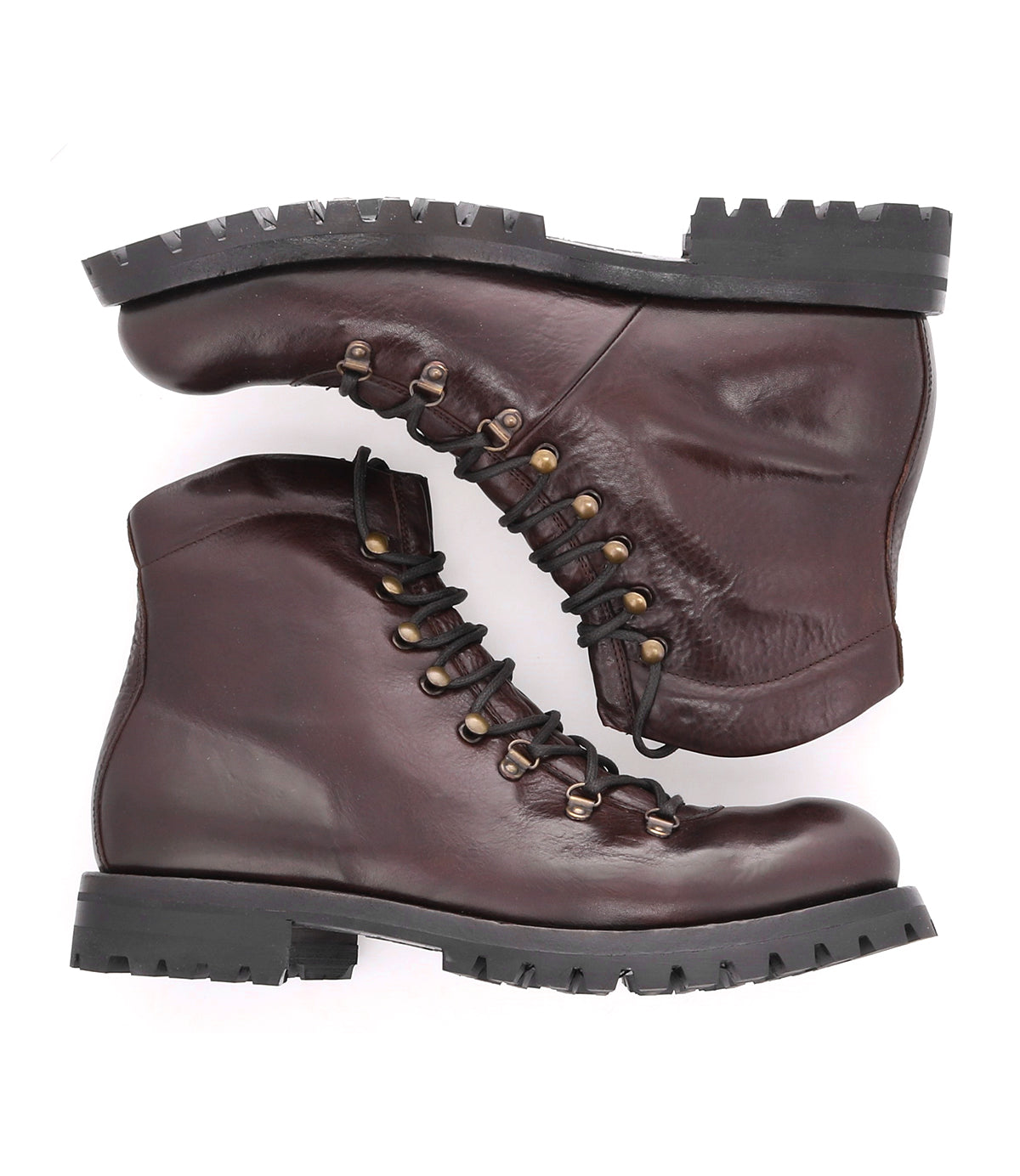 Two brown "Barge" boots by Bed|Stü, crafted from rugged leather with black, heavy-duty soles and sturdy lace-up detailing, are stacked sideways against a white background.