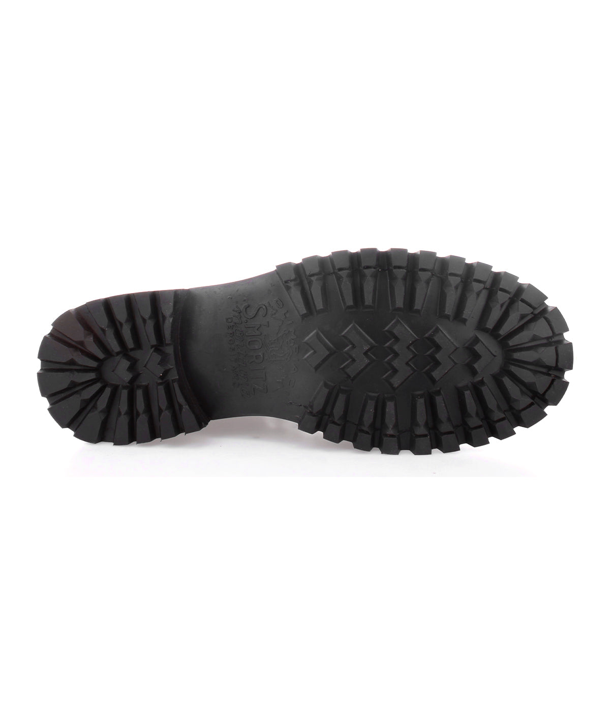 Close-up of the bottom of a Barge boot sole by Bed|Stü, featuring deep tread patterns and embossed text on black rubber, displayed against a white background—highlighting the durability and distinctive design of these rugged leather boots.