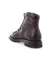 A single dark brown rugged leather boot with black laces and a thick, sturdy sole, shown from a rear-side angle on a white background—Barge by Bed|Stü is a versatile lace-up combat boot that perfectly embodies the durability and timeless style of Italian leather footwear.