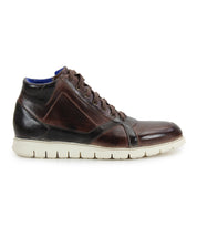 The Bed|Stü Barton high-top sneaker features a dark brown two-tone leather upper, lightweight white sole, brown laces, and blue interior lining, shown from the side.