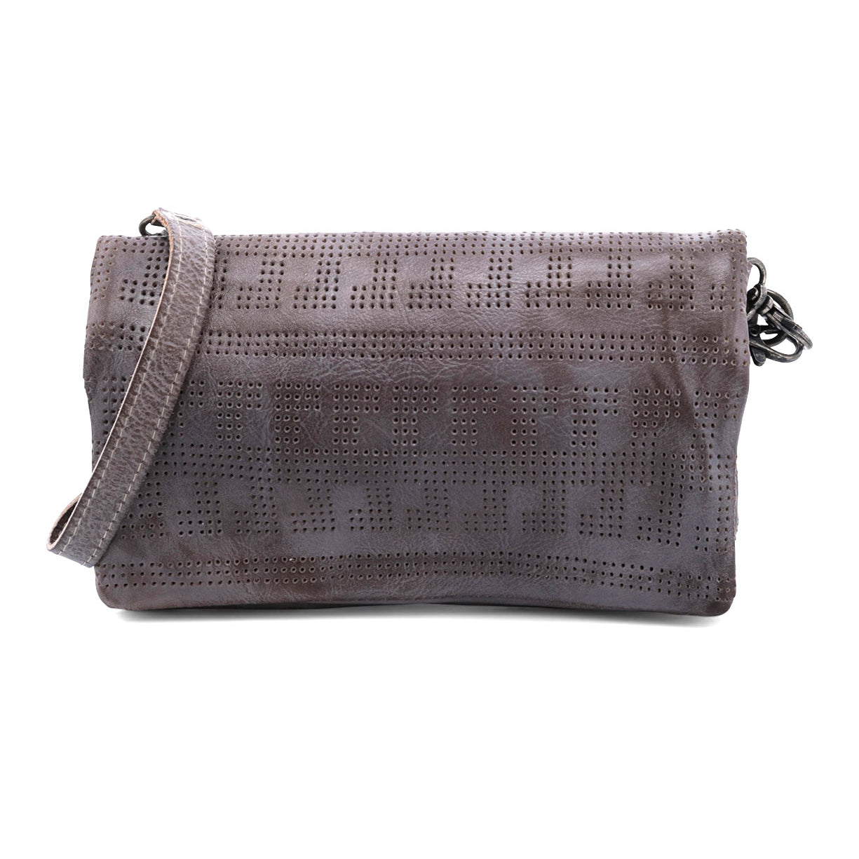 Introducing the Bayshore by Bed|Stü—a versatile gray clutch adorned with a perforated geometric pattern and complemented by a matching strap, shown against a white background. This stylish accessory seamlessly transforms from a travel wallet to a crossbody bag, offering hands-free convenience wherever you go.