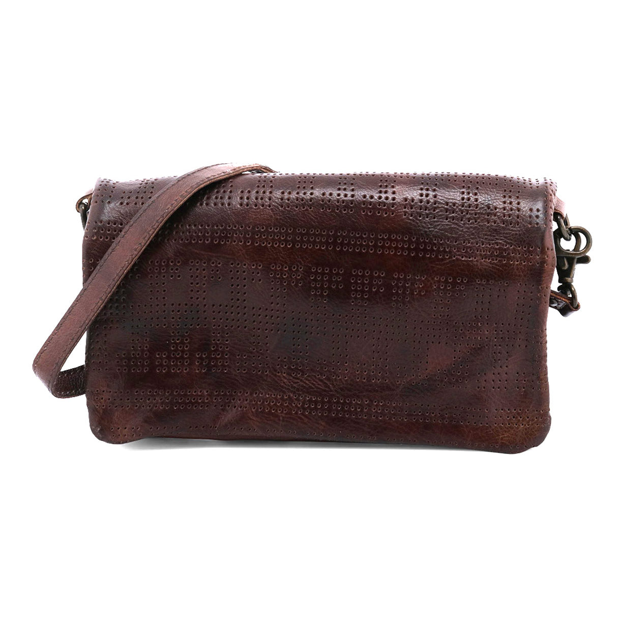 The Bed|Stü Bayshore is a brown leather crossbody bag featuring a perforated pattern and a long strap; displayed against a white background, this versatile clutch seamlessly transitions from day to night.
