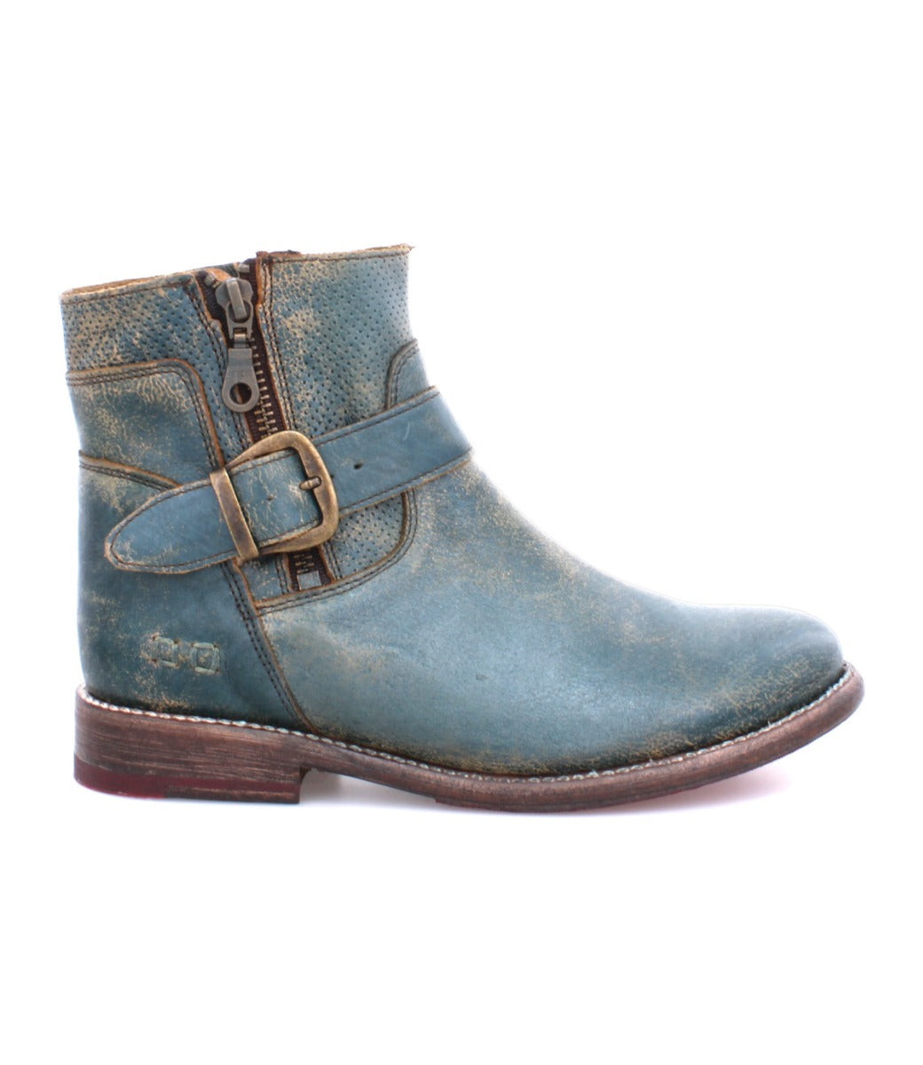 The Becca by Bed|Stü is a distressed blue leather ankle boot featuring a leather shaft, side zipper, ankle buckle strap, and low brown heel, displayed in profile on a white background.