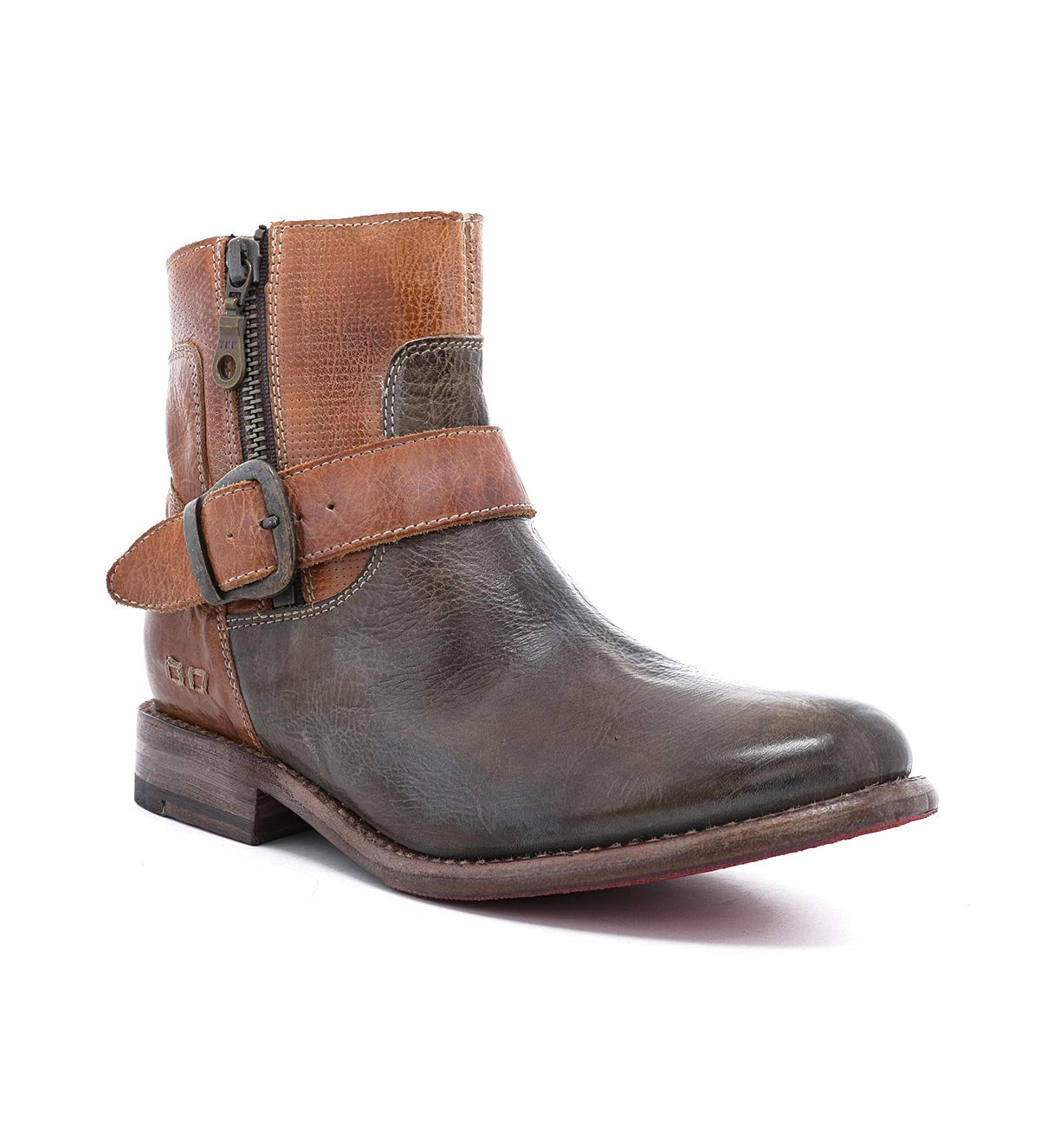 Introducing the Becca by Bed|Stü—a leather ankle boot featuring a sturdy leather shaft, convenient side zipper, brown strap with ankle buckle, and a vintage-inspired two-tone finish in brown and gray for that classic engineer boot style.