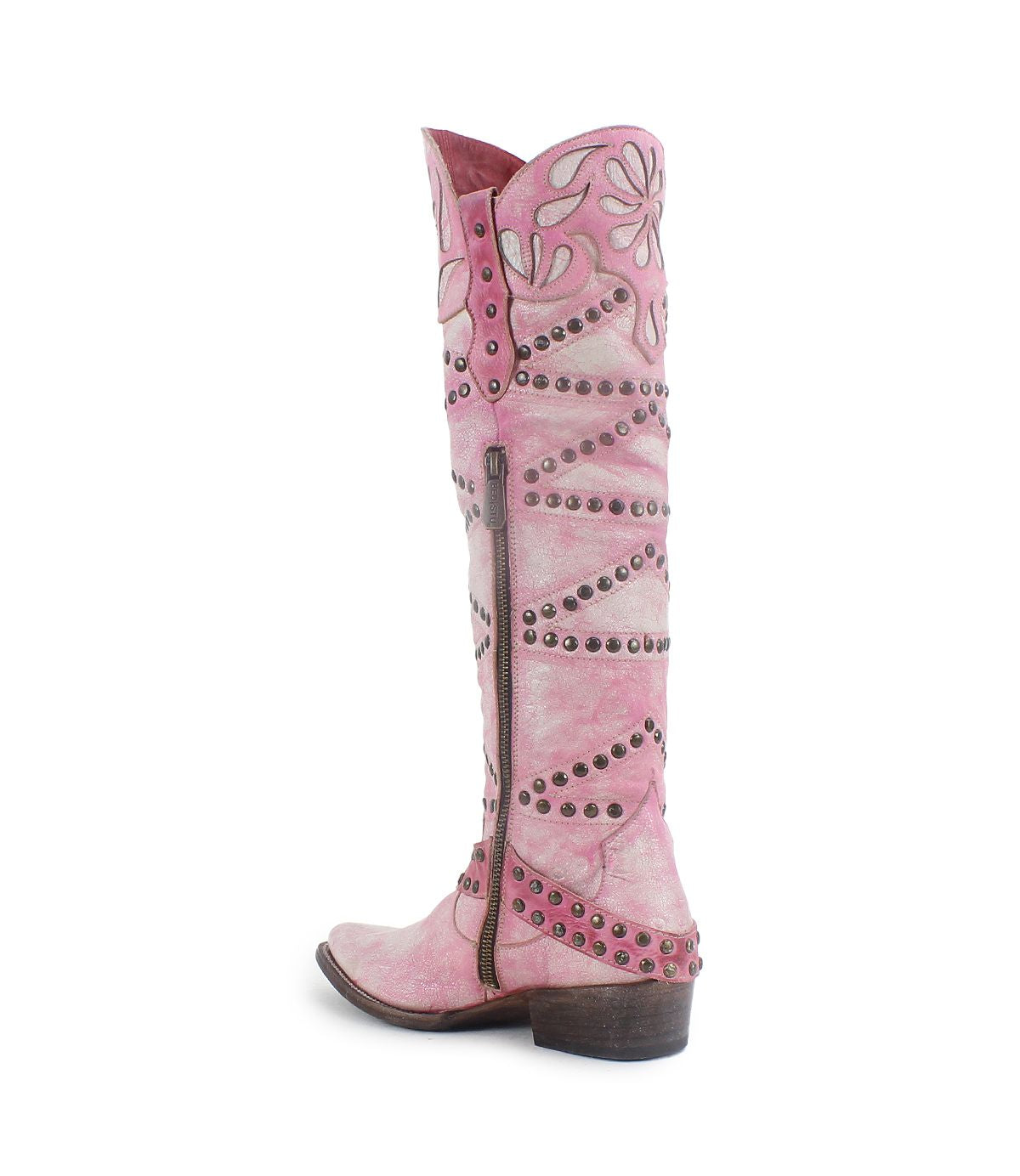The Bed|Stü Betting is a tall pink cowboy boot with decorative stitching, metal studs, and a side zipper, featuring intricate floral inlays. It is shown from a side view on a white background.
