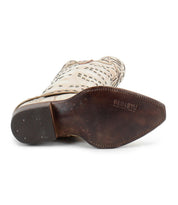 A beige Betting cowboy boot by Bed|Stü is shown from the bottom, featuring a worn brown sole stamped with the Bed|Stü logo—an authentic detail that highlights these handcrafted leather boots.