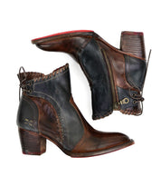 The Bia ankle boots by Bed|Stü feature handcrafted brown and black leather with side zippers, red soles, block heels, and decorative stitching, showcased against a white background.