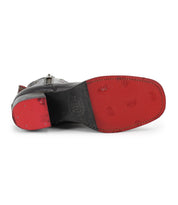 Bottom view of the Bitsy black leather boots by Bed|Stü, featuring a stacked heel, red sole, visible stitching, and textured details.