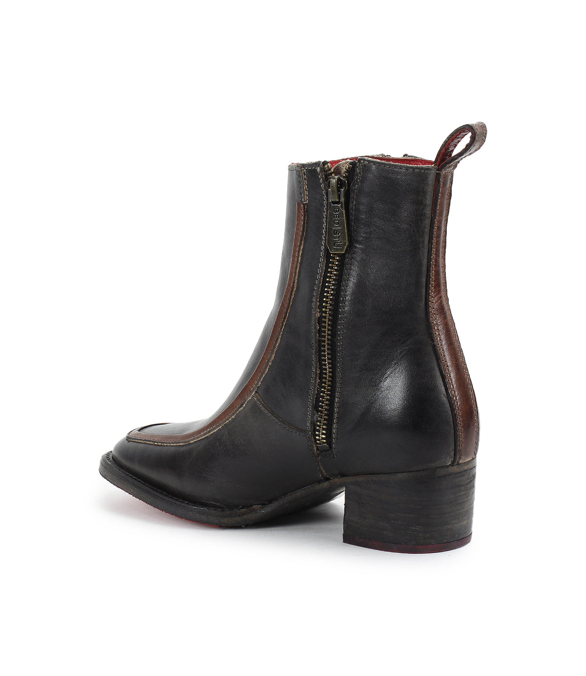The Bitsy boot by Bed|Stü is a black leather ankle boot with brown trim, featuring a side zipper, pull tab, and stacked heel. Shown on a white background, these stylish boots have a rounded toe for classic appeal.